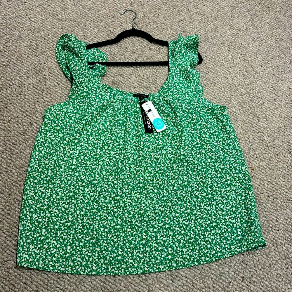 Kelly green flutter sleeve top.